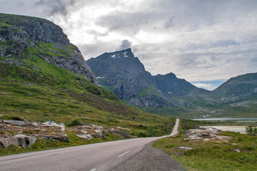 Fototapeta na wymiar Sea coast road under high mountains - Lofoten, Norway