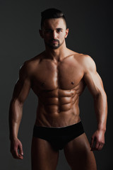 Obraz premium sexy man with muscular body in underwear pants