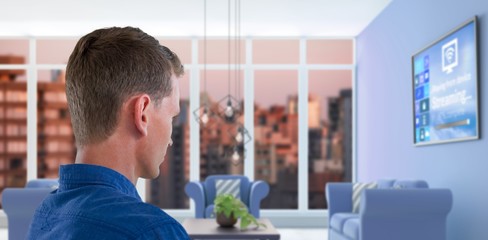 Composite image of man touching invisible screen