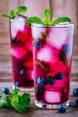 Blueberry ice lemonade with mint in glasses