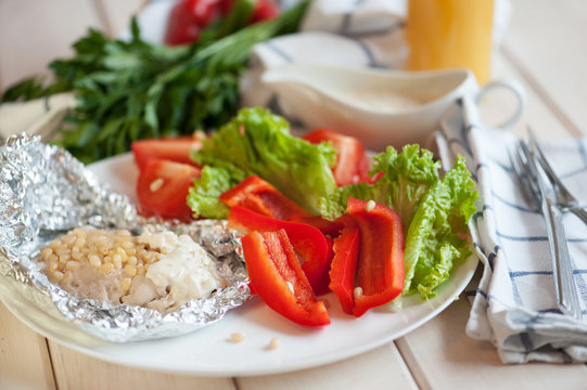 Baked fish with pine nuts