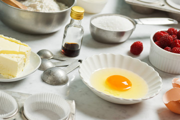 Baking Ingredients in Cups and Bowls for Raspberry Muffins