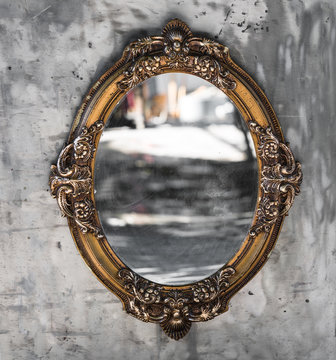 Old, Victorian, gilded, decorative frame with a mirror, baroque, rococo, the Renaissance