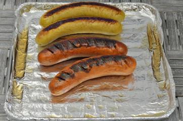 Grilled Sausages / grilled sausages on grill, close up, macro, full frame