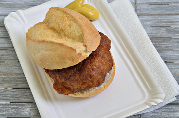 Meatball in Roll / meatball in roll on white paper plate with mustard, close up, macro, full frame