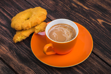coffee cup with tasty biscuit cookie