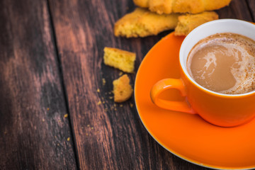 coffee cup with tasty biscuit cookie