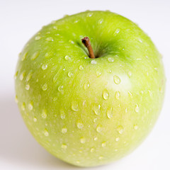  Fresh green apple on white background with water drop