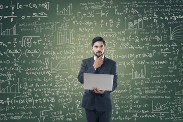 Businessman holding laptop