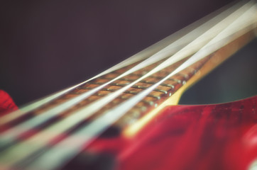 Close-up four bass guitar strings. Vintage toning