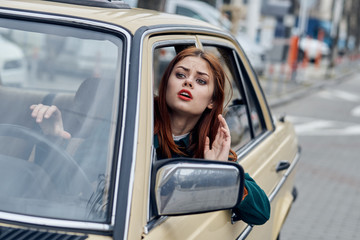 Woman driving a retro car, young woman driving a car