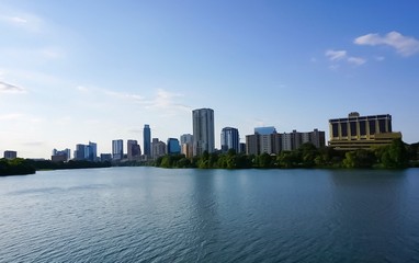 A skyline view of downtown Austin Texas from the boardwalk on Lady Bird Lake
