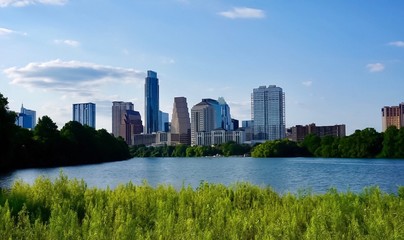 A skyline view of downtown Austin Texas from the boardwalk on Lady Bird Lake