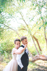 Fototapeta premium Groom and bride together. in park Wedding romantic couple outdoor