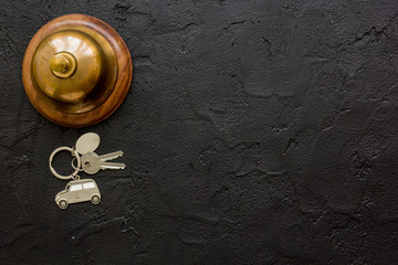 hotel reception desk with ring and keys dark table background top view mockup