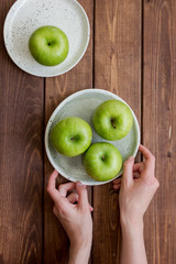ripe green apples wooden table background top view