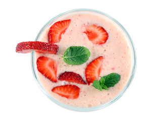 Healthy strawberry yogurt with mint leaves and fresh berries isolated on white background. Top view.
