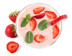 Healthy strawberry yogurt with mint leaves and fresh berries isolated on white background. Top view.