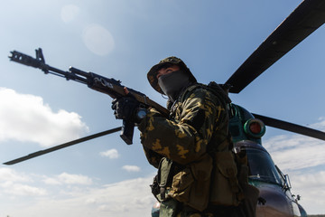 Photo of a soldier with an automatic rifle