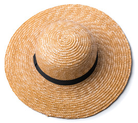 Pretty straw hat with ribbon and bow on white background beach hat top view isolated