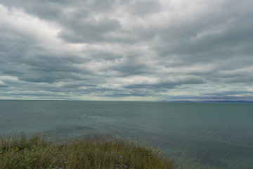Calm sea with cloudy sky 