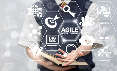 Agile Development Education Concept. Man offers agile development text icon on virtual screen. Flexible Developing Online Learning Research Knowledge Technology.