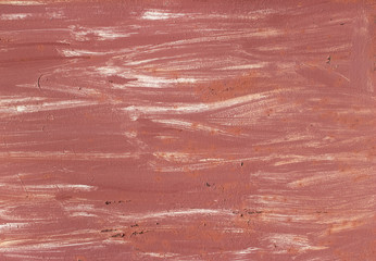 Red paint on a metal surface with a pattern