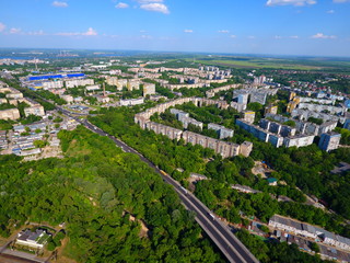 Fototapeta na wymiar Aerial view. Houses, railway, road and traffic in the city Dnepr, Ukraine.