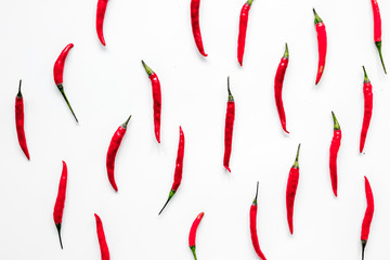 hot food with red chili pepper white table background top view pattern