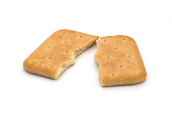 Stack of square crackers isolated on white background. Dry cracker cookies isolated
