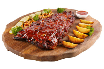 Meat grilled ribs on a white background, on a board with baked potatoes, cucumbers and pickled mushrooms