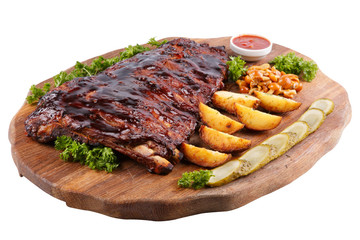 Meat grilled ribs on a white background, on a board with baked potatoes, cucumbers and pickled mushrooms