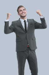 Portrait of successful business man winner celebrating