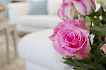 Closeup image of a decorative rose in a living room.