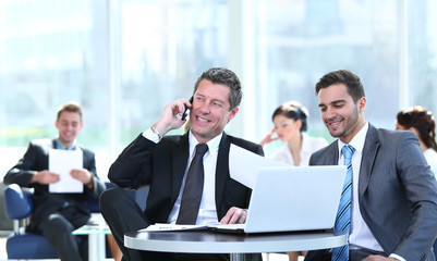 Successful business people  sitting in office and planning work