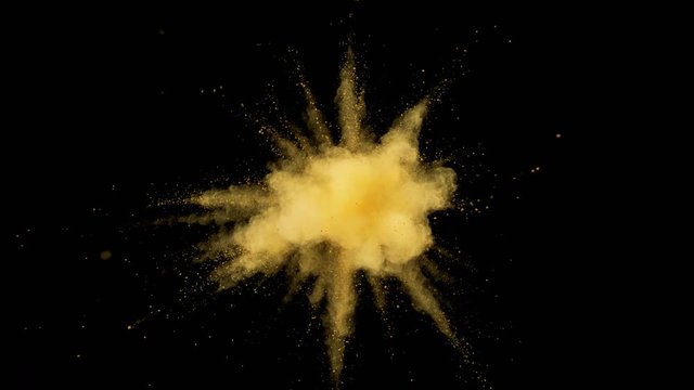 Colorful powder/particles fly after being exploded against black background. Shot with high speed camera, phantom flex 4K. Slow Motion. Included 2 different color versions.