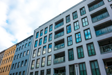 modern building next to older houses