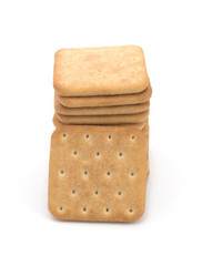 Stack of square crackers isolated on white background. Dry cracker cookies isolated