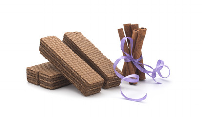 Wafers and cinnamon on a white background