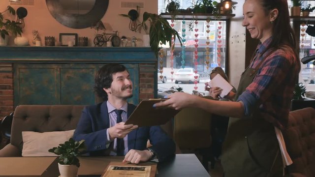 The process of writing the order of customer in cafe