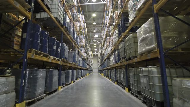 Camera moving through warehouse with racks full of merchandise