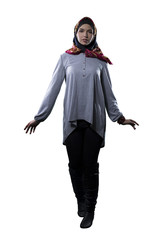 Woman wearing conservative traditional hijab with modern style clothing.  The head scarf is...