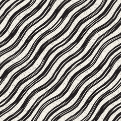 Decorative seamless pattern with handdrawn doodle lines. Hand painted grungy wavy stripes background. Trendy freehand texture