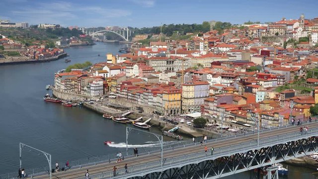 Porto city view with Douro river and Dom Luis bridge at sunny summer day, Portugal
