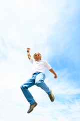 Obraz premium Man In His 50s Jumping High