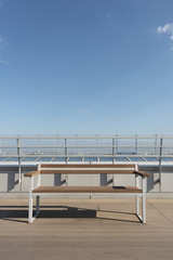 empty seat on deck with blue sky background