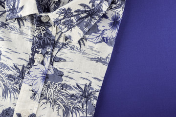 Top view of beach summer shirt with copy space