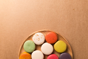 Colorful macaroons. Sweet macarons on retro background .