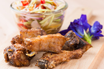 Fried fish with mango salad