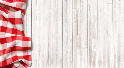 red checkered picnic tablecloth on subtle wood table